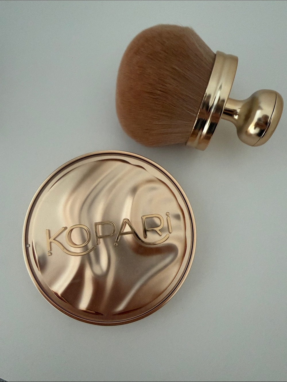 Kopari sun veil illuminating sunscreen powder SPF 30 with brush